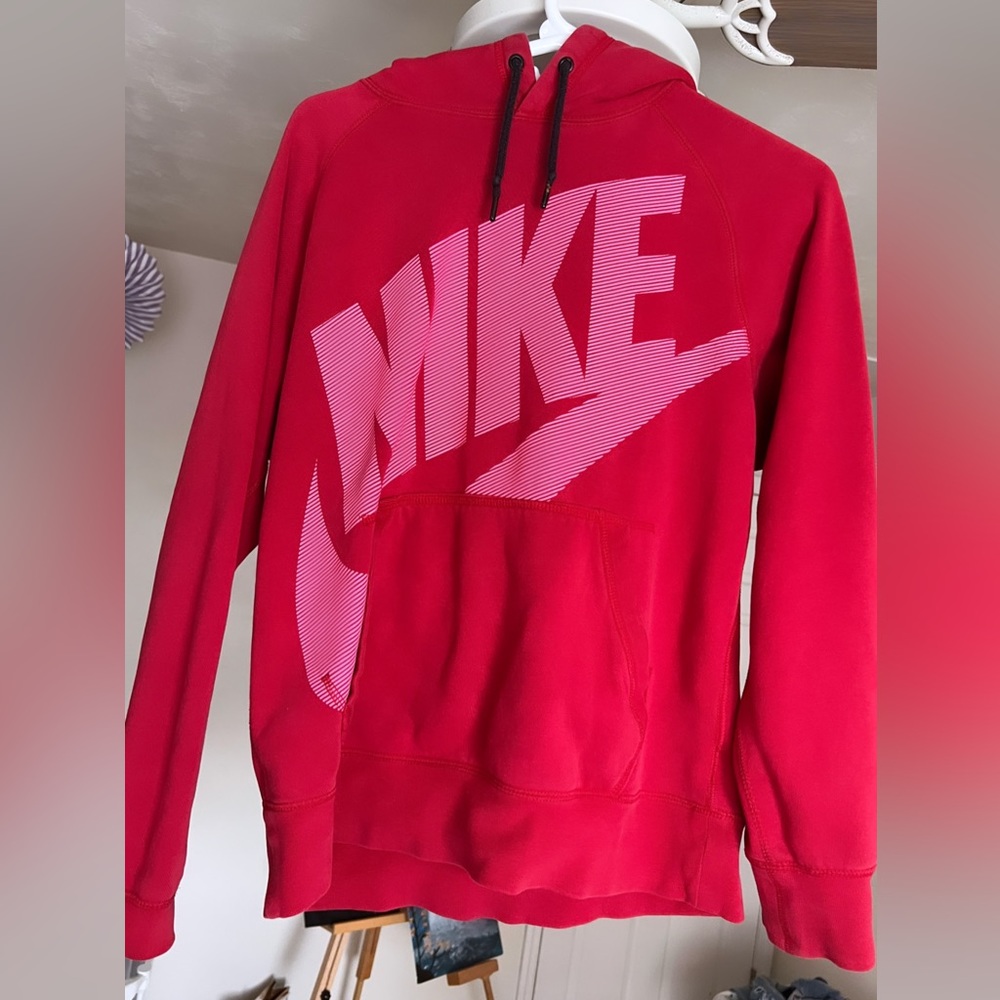Red NIKE sweat shirt.